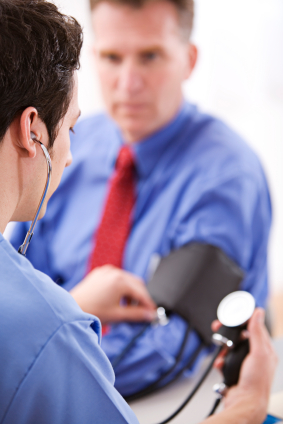 Patient getting his blood pressure checked by his doctor