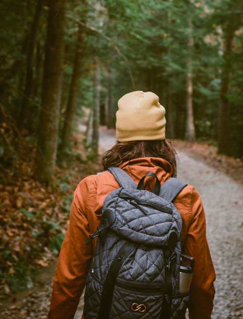 wearing a rock filled backpack