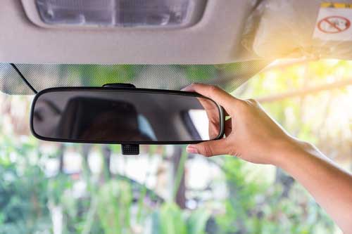 adjusting the rear view mirror