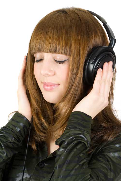 Wearing a pair of headphones